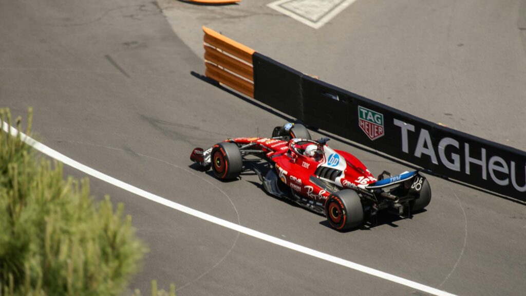 Ferrari Formula 1 Racing Car Speeding on Track Desktop Wallpaper