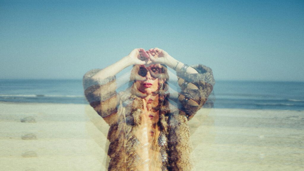 Surreal Woman in Fur Coat on Beach Double Exposure 4K Wallpaper