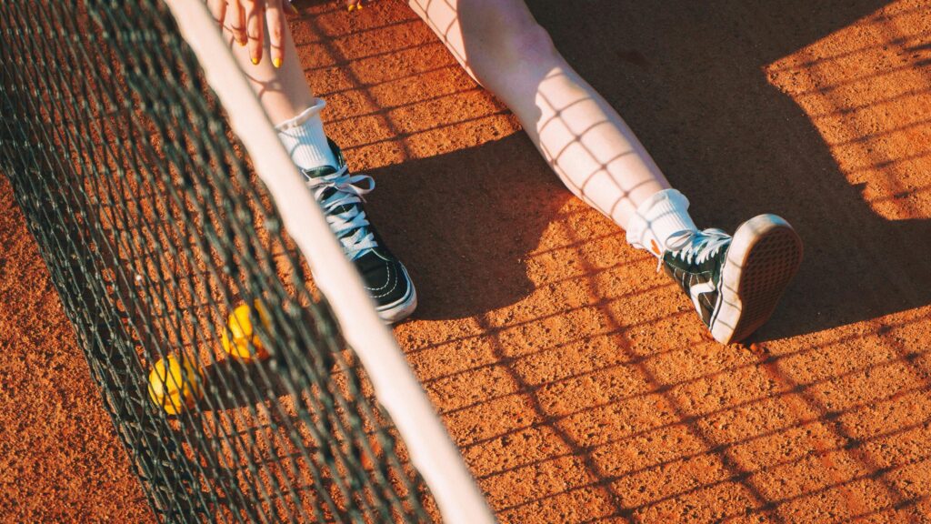Relaxing Tennis Court Scene with Sneakers and Balls 4K Wallpaper