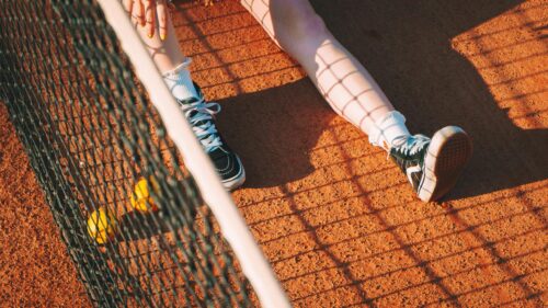 Relaxing Tennis Court Scene with Sneakers and Balls 4K Wallpaper