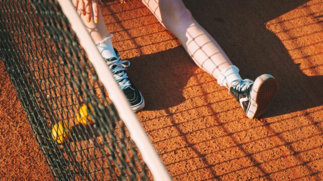 Relaxing Tennis Court Scene with Sneakers and Balls 4K Wallpaper