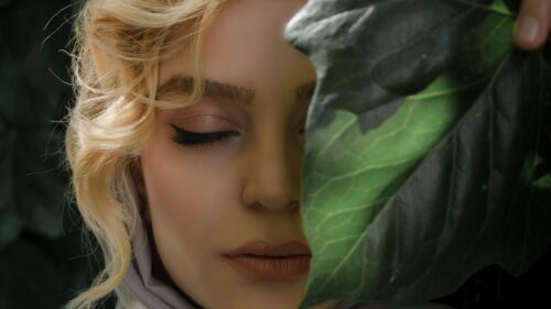 Blonde Woman Behind A Leaf Beauty Portrait 4K Desktop Wallpaper