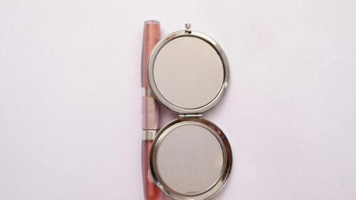 Minimalist Makeup Mirror and Lip Gloss Elegance 4K Wallpaper