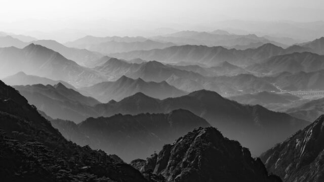 Breathtaking Misty Mountain Range Layers 4K PC Desktop Wallpaper