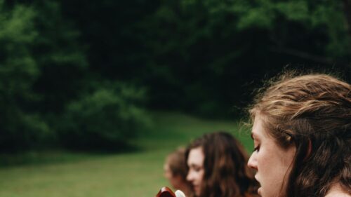 Close-up Portrait of Friends Singing Outdoors Desktop Wallpaper