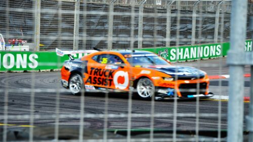 Orange Truck Assist Chevrolet Supercar Racing Action 4K Wallpaper