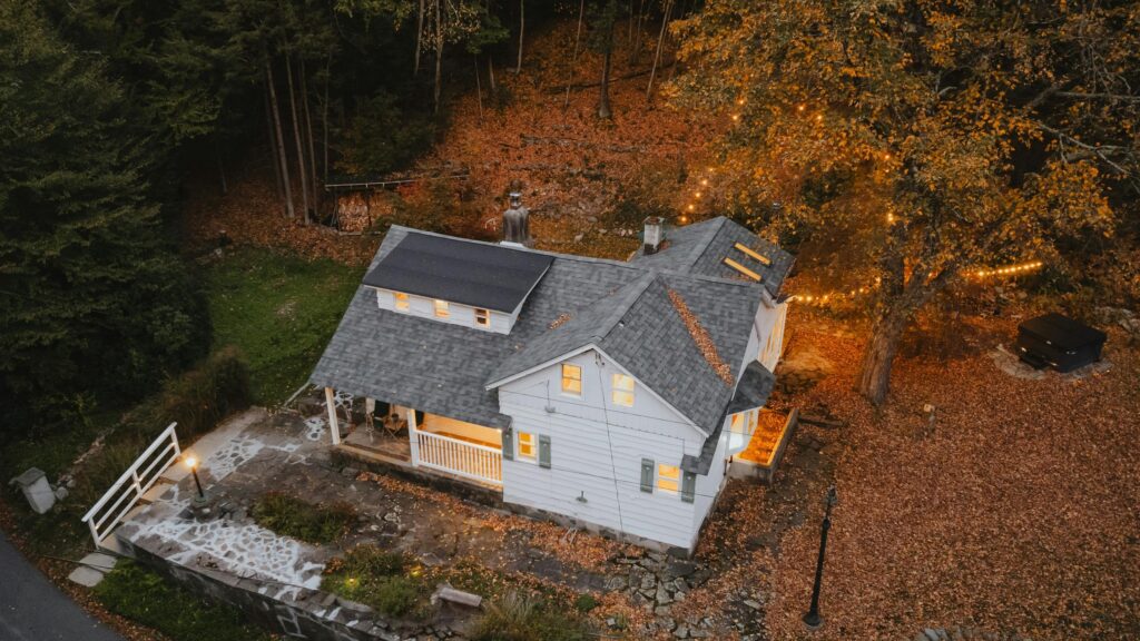 Cozy White Cottage in Autumn Forest Landscape Desktop Wallpaper