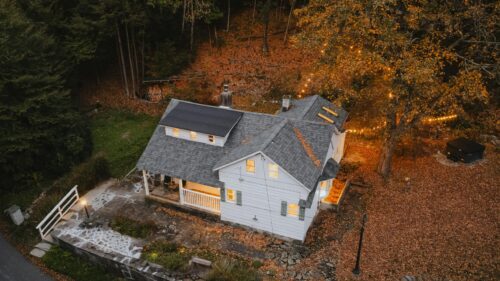 Cozy White Cottage in Autumn Forest Landscape Desktop Wallpaper