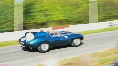 Classic Blue Jaguar D-Type Racing Car Speeding on Track 4K Wallpaper