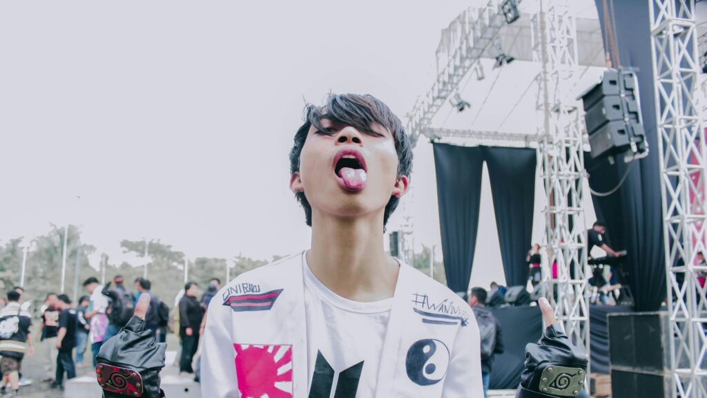 Anime Inspired Aesthetic Guy Sticking Tongue Out PC Wallpaper