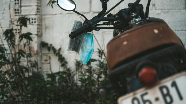 Motorcycle Handlebar with Medical Masks Outdoors 4K Wallpaper
