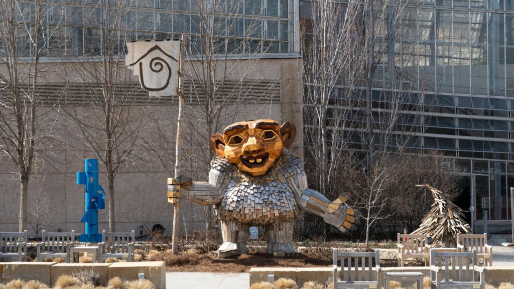 Wooden Troll Sculpture with Flag Outdoor Art Desktop Wallpaper