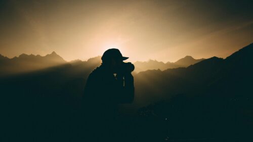 Silhouette Photographer Mountains Golden Hour 4K Desktop Wallpaper