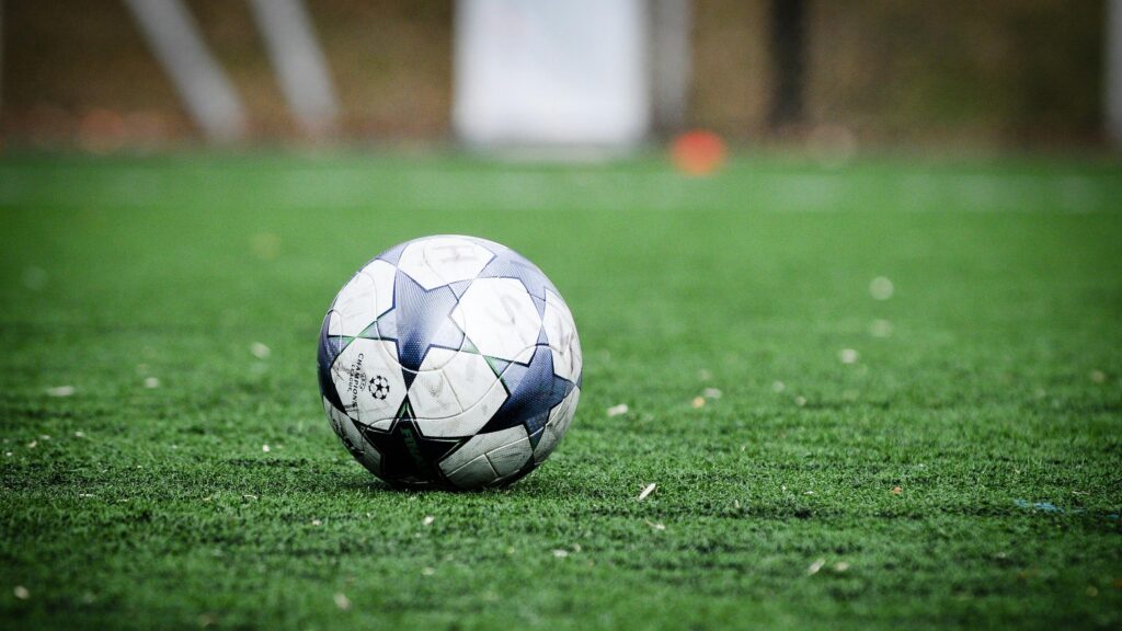 UEFA Champions League Soccer Ball on Green Pitch 4K Wallpaper