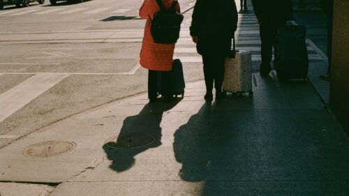 People Waiting at Crosswalk with Luggage Travel Scene Desktop Wallpaper