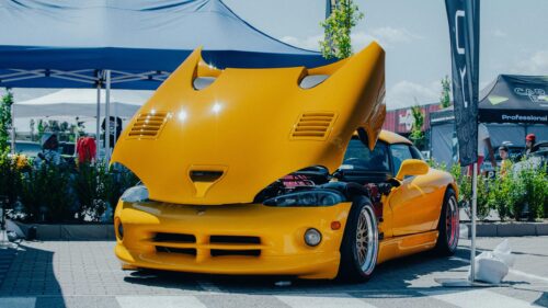 Stunning Yellow Dodge Viper with Open Hood Car Show Desktop Wallpaper
