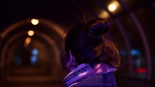 Woman in Tunnel with Cinematic Neon Lighting 4K Wallpaper