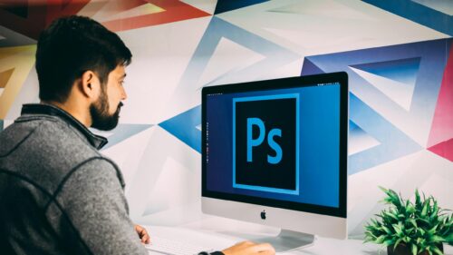 Creative Graphic Designer Working on Adobe Photoshop Desktop Wallpaper