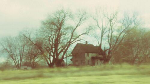 Abandoned Rustic Farmhouse in Foggy Fields 4K Desktop Wallpaper
