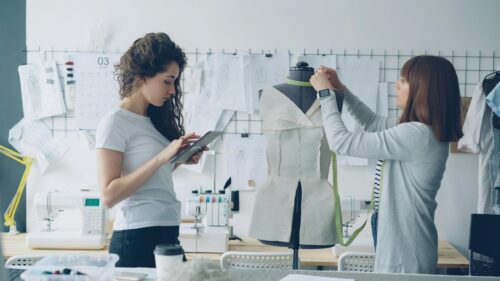 Creative Fashion Designers Working in Tailoring Studio 4K Wallpaper