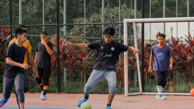 Youth Soccer Players Training on Outdoor Court 4K Desktop Wallpaper