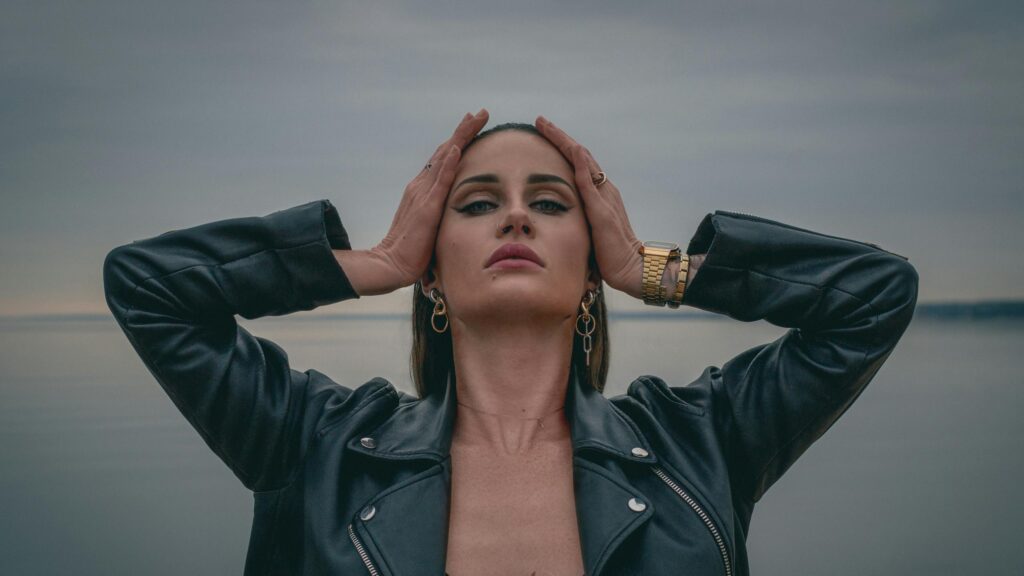 Edgy Woman in Leather Jacket Posing at Sunset PC Wallpaper