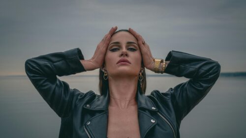 Edgy Woman in Leather Jacket Posing at Sunset PC Wallpaper
