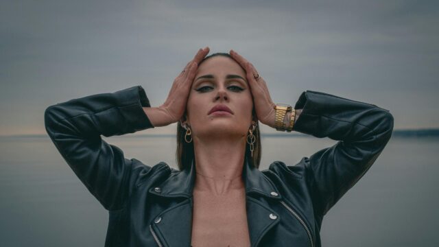 Edgy Woman in Leather Jacket Posing at Sunset PC Wallpaper