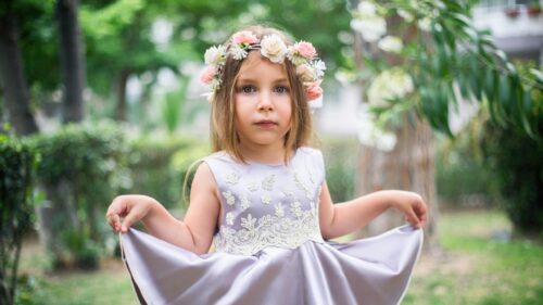 Adorable Little Girl with Flower Crown in Summer Garden 4K Wallpaper