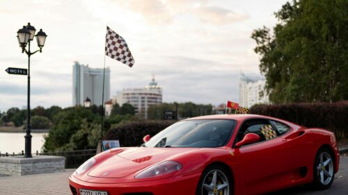 Red Ferrari Sports Car Test Drive Scene 4K Desktop Wallpaper