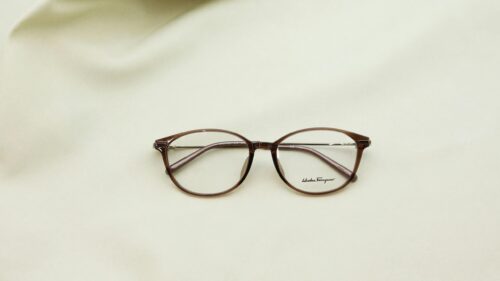 Minimalist Salvatore Ferragamo Glasses on Soft Neutral Background 4K Wallpaper