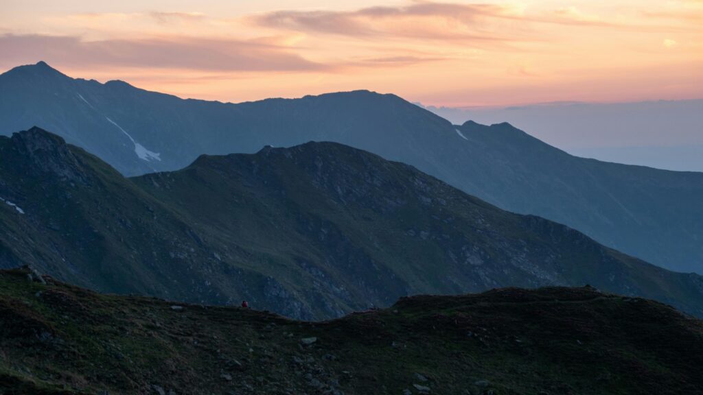 Serene Mountain Ridge at Golden Hour Sunset Desktop Wallpaper