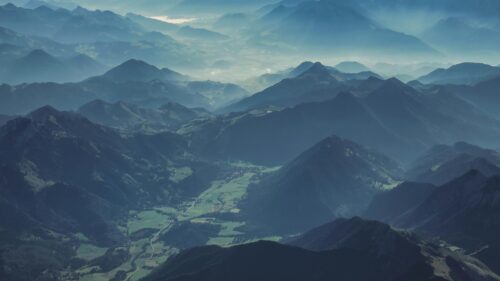 Breathtaking Alpine Mountain Valley Aerial View 4K Wallpaper