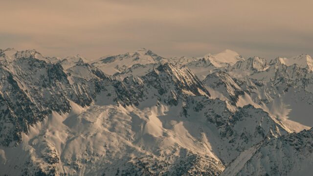 Snow Capped Alpine Peaks at Sunset 4K Desktop Wallpaper