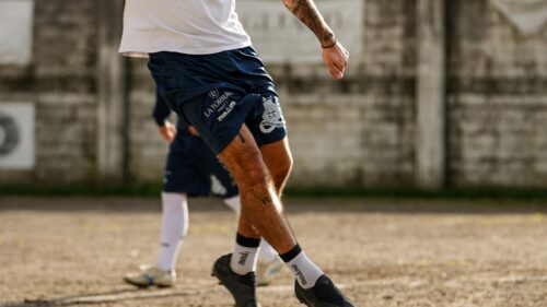 Soccer Player Mid-Kick Action Shot 4K Wallpaper