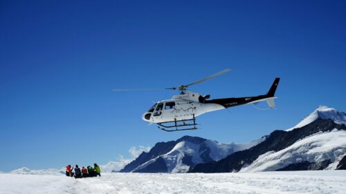 Helicopter Landing on Snowy Swiss Alps Adventure 4K Wallpaper