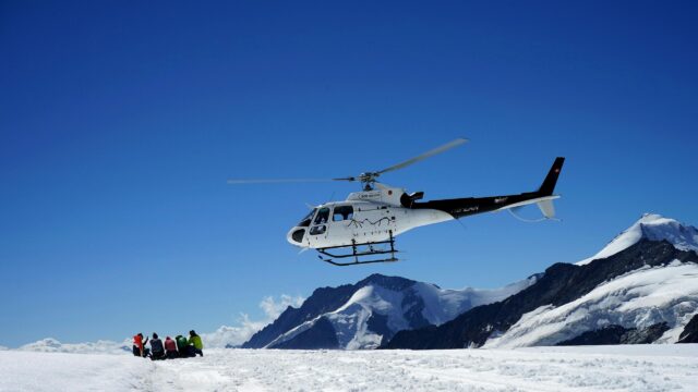 Helicopter Landing on Snowy Swiss Alps Adventure 4K Wallpaper