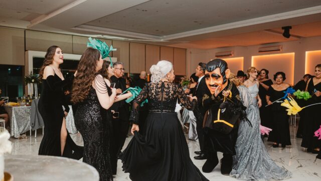 Celebratory Gala Party with Masked Performer 4K Wallpaper
