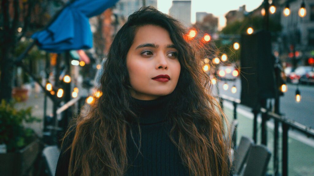 Stunning Portrait of a Woman with Dark Lipstick Evening City Lights 4K Wallpaper