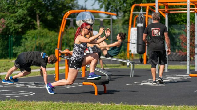 Group Fitness Workout at Outdoor Park 4K Wallpaper