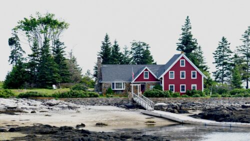 Charming Red Cottage by the Coastal Shore Desktop Wallpaper