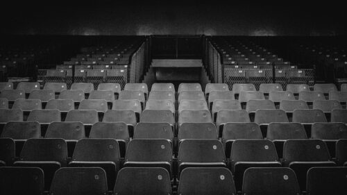 Empty Theater Seating Rows Dramatic Black and White 4K Wallpaper