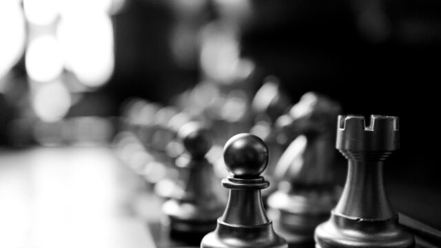 Close-up Macro Shot of Chess Pieces on Board 4K Wallpaper
