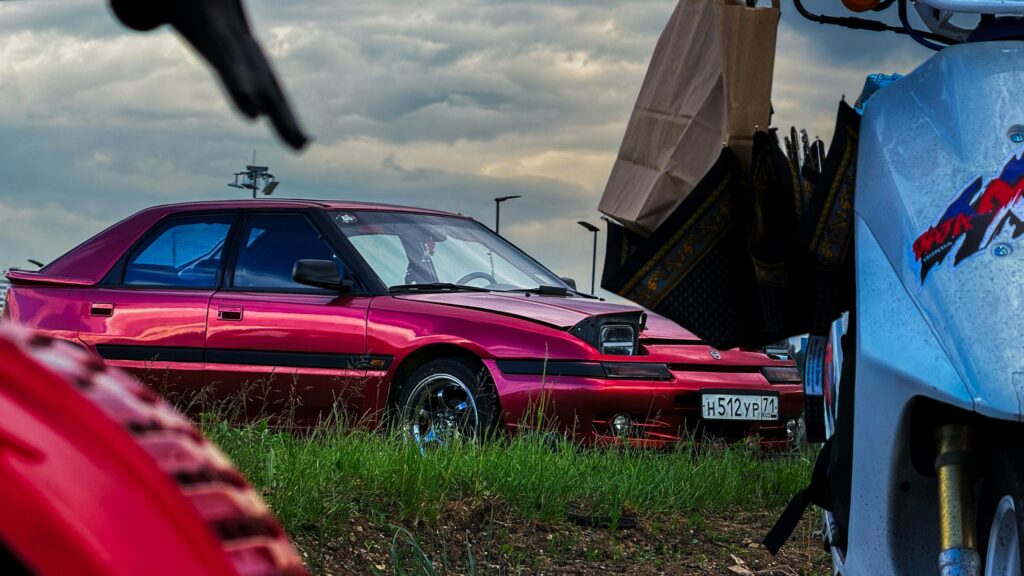 Custom Red Mazda 323F Pop-Up Headlight Sedan 4K Desktop Wallpaper