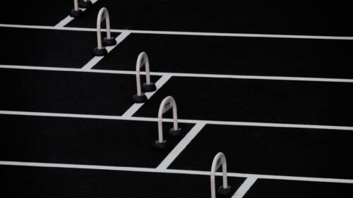 Minimalist White Hurdles on Black Track Texture Desktop Wallpaper