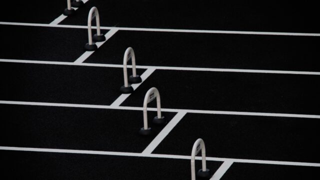 Minimalist White Hurdles on Black Track Texture Desktop Wallpaper