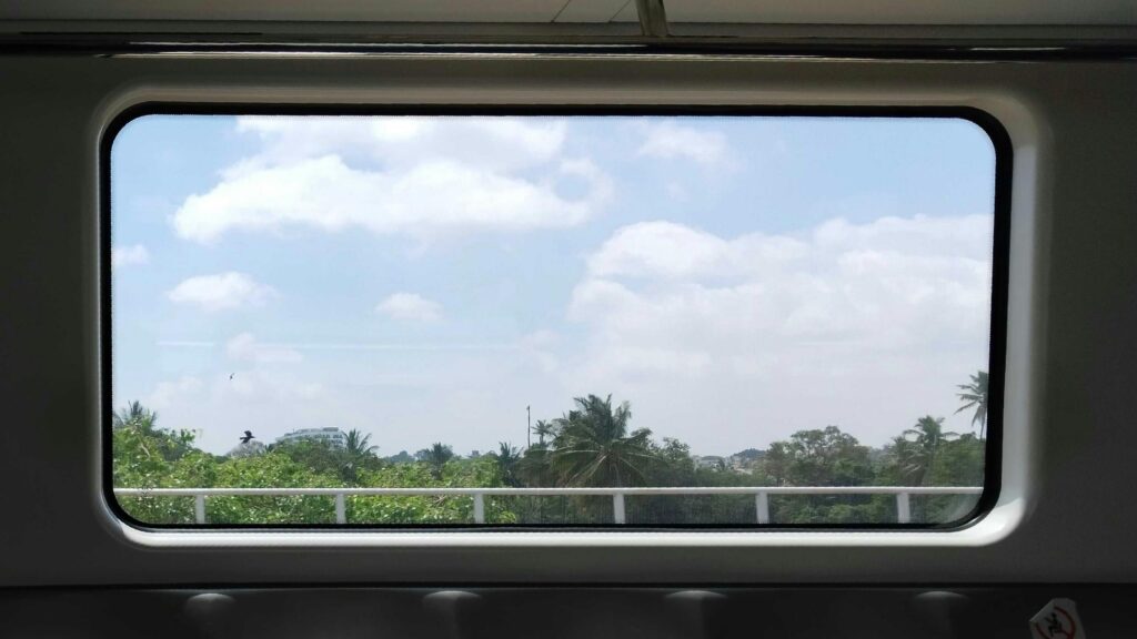 Train Window View of Tropical Landscapes and Blue Skies Desktop Wallpaper