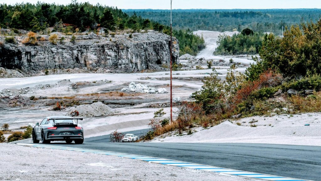 Porsche GT3 RS Racing Through Scenic Stone Quarry Desktop Wallpaper