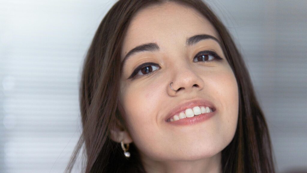 Close Up Portrait of a Beautiful Smiling Woman with Nose Ring 4K Wallpaper
