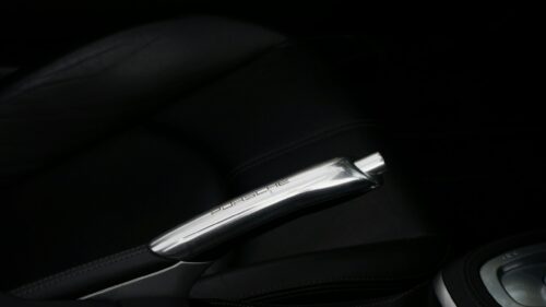 Elegant Porsche Metallic Handbrake Interior Close-up 4K Wallpaper